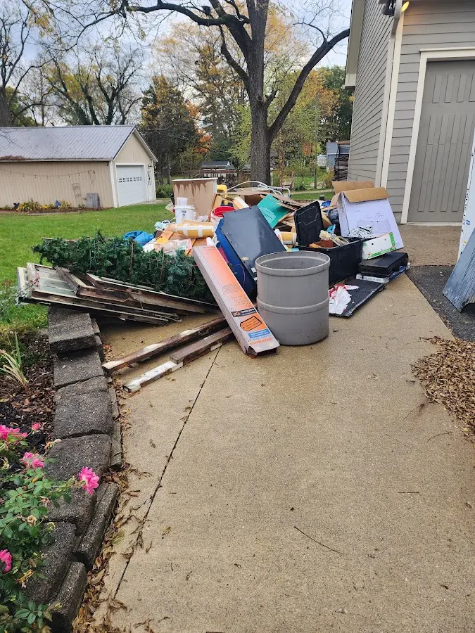 Dumpster being loaded with debris for 12 Yard Dumpster Rental in Galliano